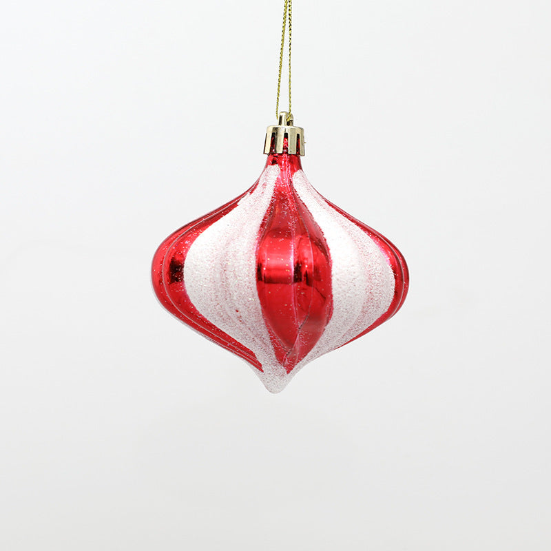 Juldekoration i form av godiskäpp, presentask och stövelhänge