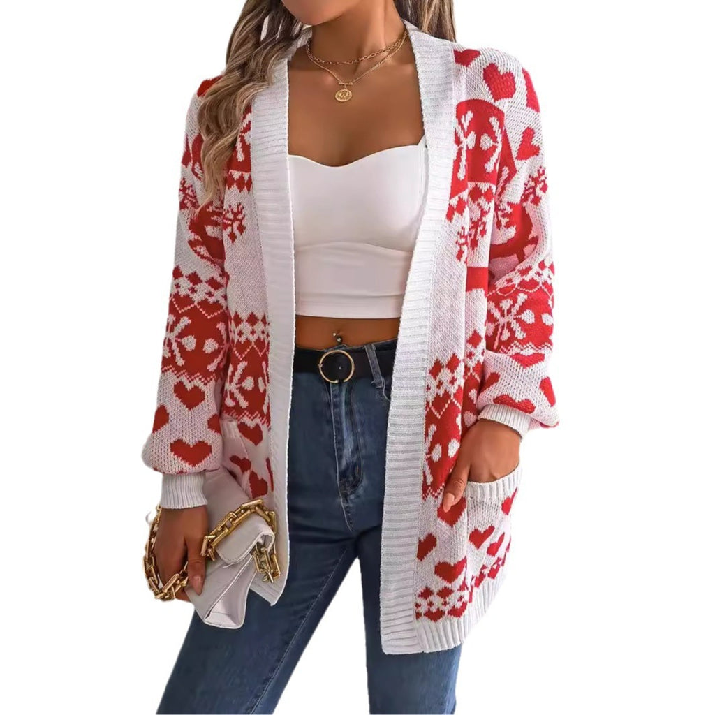 Öppen julkofta med renmotiv och lyktärmar