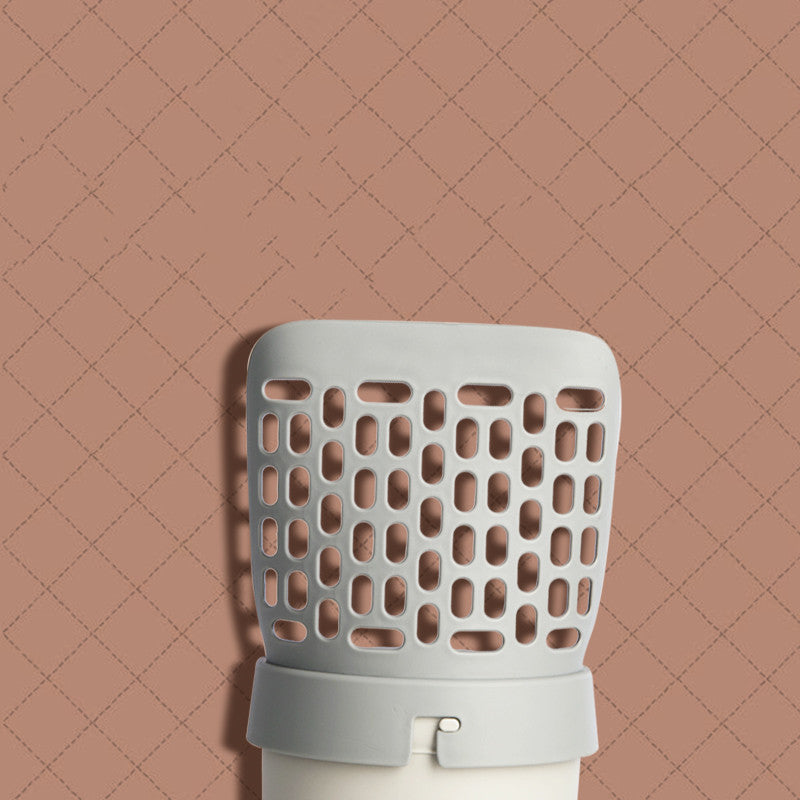 Denna integrerade spade för kattsand är designad för att göra rengöringen av kattlådan enklare och mer hygienisk.