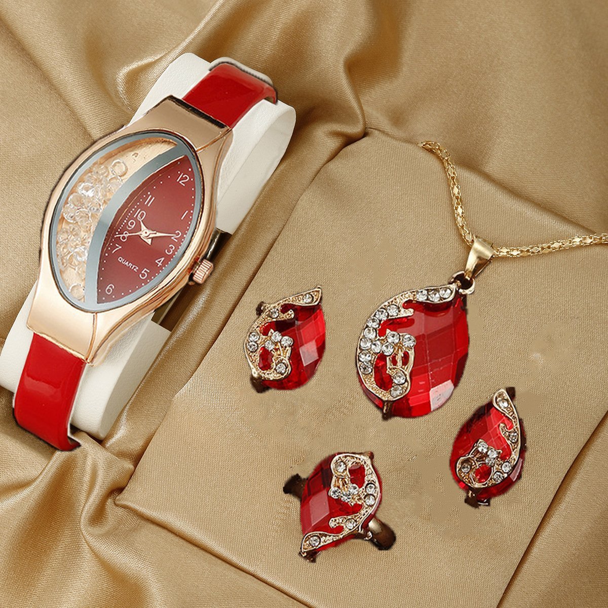 Presentset med modernt smyckestema som inkluderar kvarsurdriven klocka, halsband, armband, ring och örhängen.
