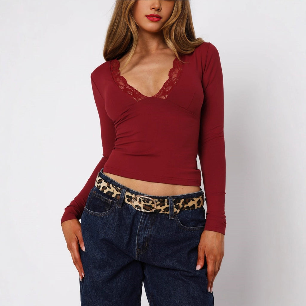 Yksivärinen V-kaula-aukollinen pitsireunainen pitkähihainen vartalonmyötäinen toppi