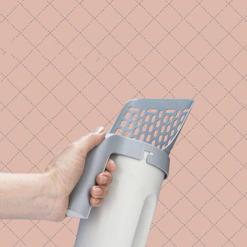 Denna integrerade spade för kattsand är designad för att göra rengöringen av kattlådan enklare och mer hygienisk.